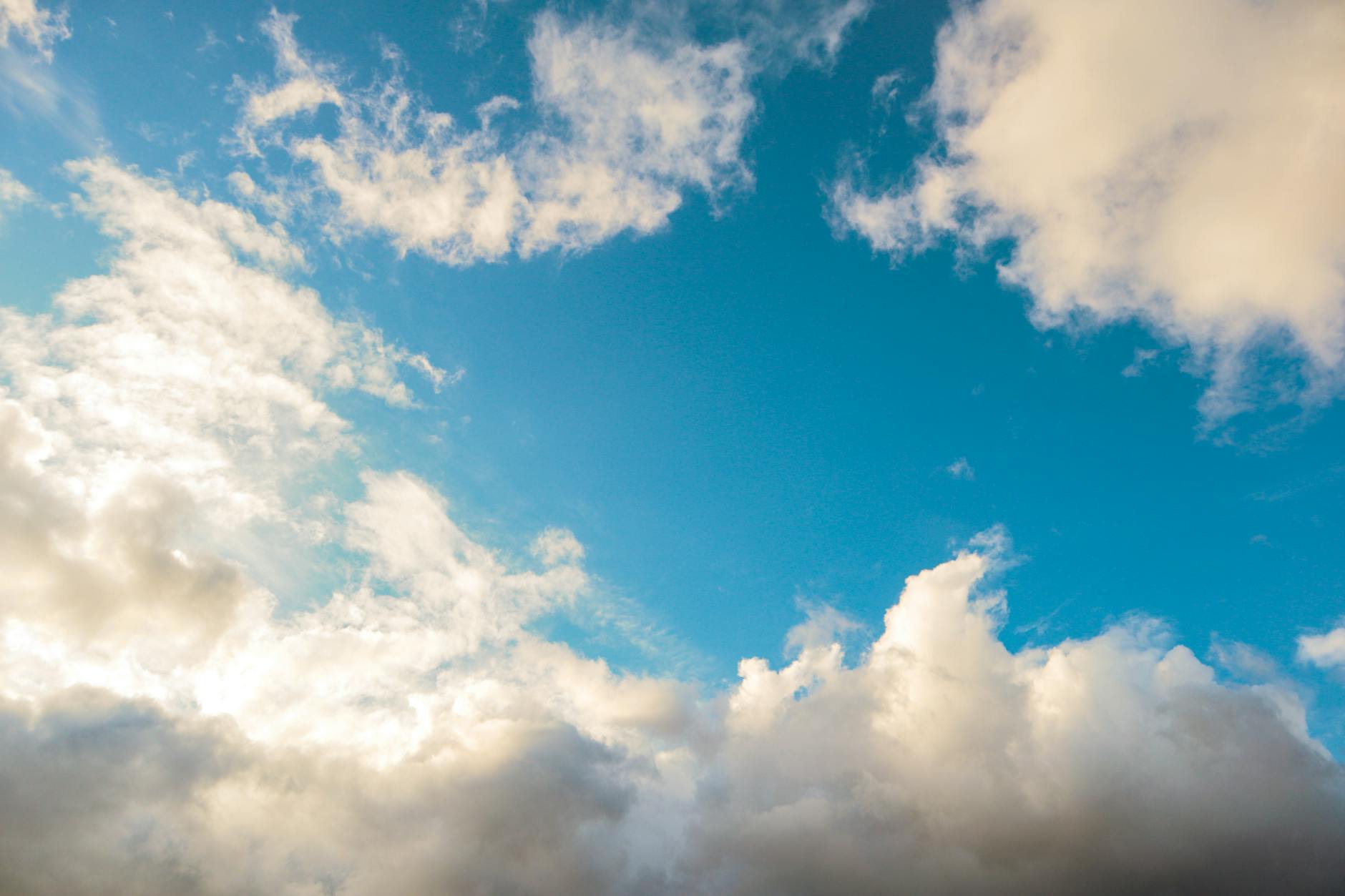 vibrant blue sky with fluffy clouds